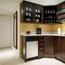 Residence Inn by Marriott Montreal Downtown kitchenette with stainless steel fridge, microwave and dark wood cabinets