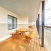 Surf House in Hampton balcony with picnic tables, blue door and ocean-facing railing