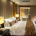 Wuzhou Guest House, Shenzhen: elegant guest room with king bed, bedside lamps, and seating area