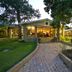 Anew Resort White River Mbombela in White River, garden path leading to lit resort building at dusk