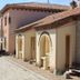 Hotel Vettonia in Ávila with stone courtyard, terracotta roof, and outdoor seating