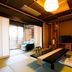 Houraiya in Kamogawa: tatami room with low table, TV, and balcony seating