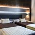 Mediterranea Hotel & Convention Center Salerno twin room with two beds and bedside lamps