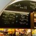 Hotel Vinothek Schwarzer Adler in Ottensheim with a chalkboard menu, shelves of jars, and deli food display