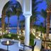 Jaz Fanara Resort in Sharm el-Sheikh with palm-lined arches overlooking a lit seaside garden and pool
