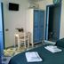 Camere D'Aragona Otranto room with bed, desk, wardrobe and en suite bathroom door