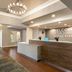 Hampton Inn & Suites Ft. Lauderdale Airport/South Cruise Port lobby with front desk and chandelier in Hollywood