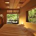 Gora Kadan in Hakone guest room with bed and large windows overlooking lush greenery