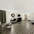 Red Roof Inn & Suites Duncan guest room with king bed, desk, sofa, TV and wood-look flooring