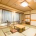 Kumano No Yado Umihikari in Kumano, tatami room with low table, chairs and large curtained window