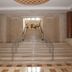 Nour Palace Resort And Thalasso in Mahdia: grand marble staircase with central mural and handrails