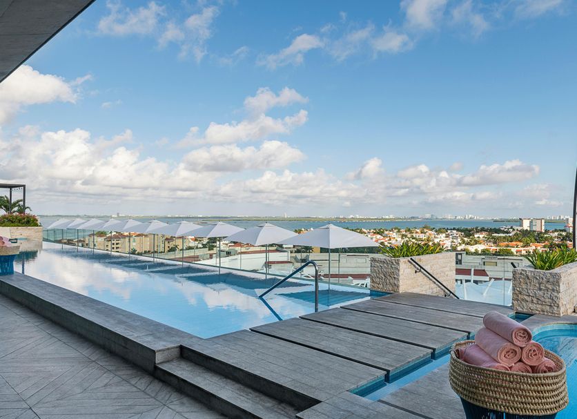 Canopy by Hilton Cancun La Isla rooftop infinity pool with city and ocean views in Cancún