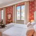 Pousada Viana do Castelo in Viana do Castelo, elegant room with floral wallpaper and twin beds by tall windows.