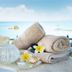 Vrissiana Boutique Beach Hotel in Protaras: spa towels and plumeria on a tray with sea view