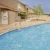 Huiquan Boutique Hotel in Jinan with outdoor swimming pool and lounge chairs beside the building