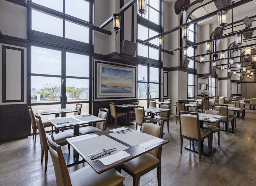 Premier Hotel Mojiko dining room in Kitakyushu with large windows and city views