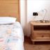 Borcanela Apartments in Moena bedroom with single bed and wooden nightstand