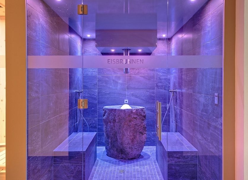 Hotel am Wiesenhang - Garni spa sauna in Bad Kohlgrub with purple lighting and stone basin