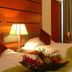 Oriental Crystal Hotel in Kajang guest room with two beds, bedside lamps and fruit basket