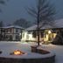 Victoria Resort And Bed & Breakfast in South Haven: snowy courtyard with fire pit and lit guest buildings