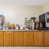 Super 8 by Wyndham Ashland/Richmond breakfast area with coffee, juice, cereal and snack dispensers
