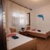 Apartments Alissa, Hvar: twin guest room with two single beds, window blinds, and wooden floor
