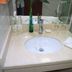 Yiwu Mango Hotel in Jinhua bathroom sink with toiletries and glass countertop