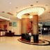 Nan Xiang Hotel - Guiyang lobby with circular chandelier, marble columns, and polished floor