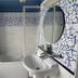 Les Bords de Seine in La Roche-Guyon bathroom with tub, pedestal sink and blue mosaic tile accents