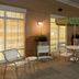 Outdoor patio seating at Fairfield Inn & Suites by Marriott Lewisburg in Lewisburg with tables and umbrellas