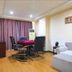 Chengdu Tianfu Lidu Hotel in Chengdu, room with seating area, table, chairs, and curtains