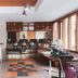 Hotel Tibera Taman Cibeunying Bandung lounge with bar seating, coffee station, and large windows