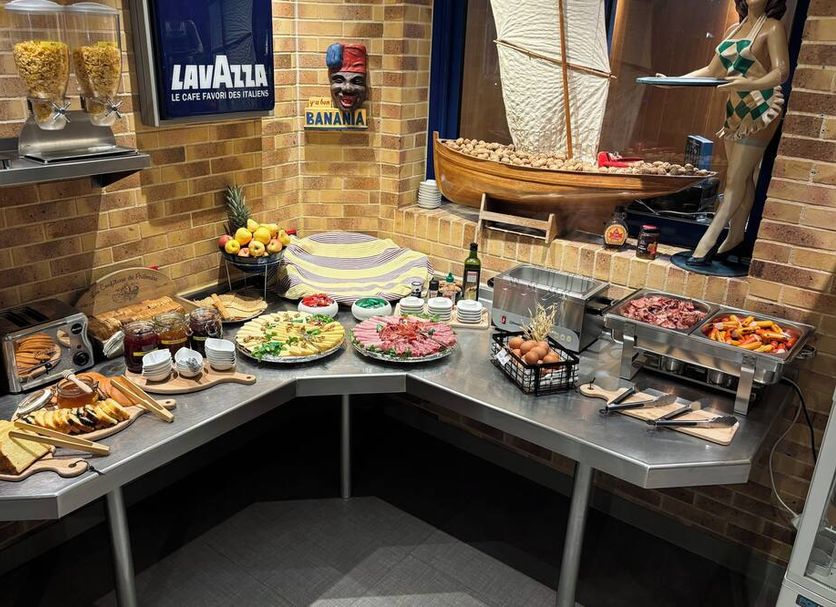 Hotel Arcantis Le Voltaire Rennes breakfast buffet with pastries, fruit, cold cuts and hot dishes