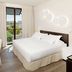 H10 Port Vell Barcelona room with king bed, desk, and balcony view