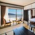 Kirishima Kokusai Hotel room with tatami seating, twin beds and ocean view balcony in Kirishima
