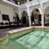 Riad Jardin Des Rêves in Marrakech courtyard pool with arched white walls and seating area