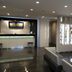 Jr-East Hotel Mets Nagaoka lobby with front desk, seating area, and display cabinet in Nagaoka