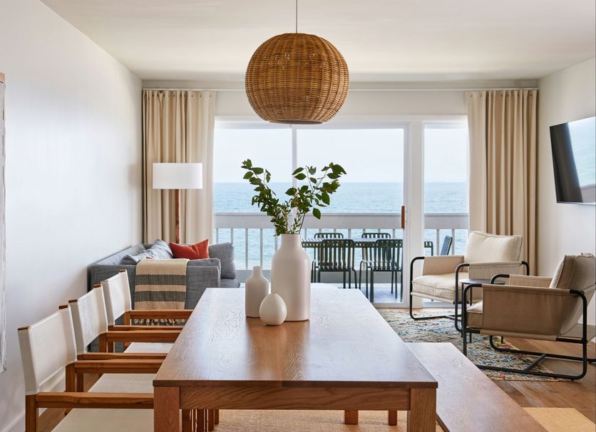 Sound View Greenport dining area with ocean-view balcony and seating in Greenport