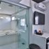 San Diego Suites Pampulha Hotel bathroom with glass shower and soaking tub in Belo Horizonte