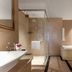Grand Metropark Hotel Shangqiu bathroom with walk-in shower, soaking tub and double vanity