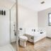 Bella Vista Motel Whangarei bathroom with walk-in shower, toilet, and corner jetted tub