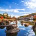 Aomoriya by Hoshino Resorts in Misawa with pond, rocks, autumn trees, and blue sky reflections