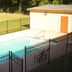 Western Motel Inn and Suites Hazlehurst pool area with fenced outdoor pool and lounge chairs in Hazlehurst