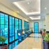 d'primahotel Kualanamu Medan lobby corridor with blue seating and large windows in Medan