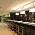 Eka Hotel Nairobi bar and lounge in Nairobi with long counter, stools and pendant lights