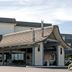 The Polynesian Resort in Ocean Shores with a covered entrance and landscaped front exterior