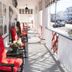 Quaker Inn in Ocean Grove porch with red rocking chairs and street view