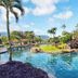 Hanalei Bay Resort in Princeville with tropical lagoon pool, palm trees and mountain views