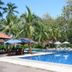 Sanghyang Indah Spa resort in Anyar with a palm-lined outdoor pool and lounge chairs