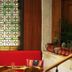 Zunfthaus zu Wirthen in Solothurn with red banquette seating and stained glass windows